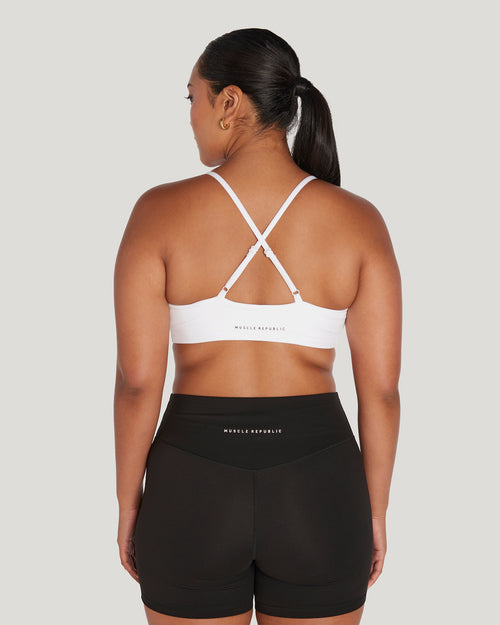 TnaBUTTER Volley sports bra core collection white - Depop