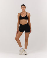 SEAMLESS MID RISE INVISIBLE SCRUNCH MINI SHORTS - BLACK