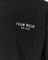 ESSENTIALS TEE - BLACK TEAM MSCR 2026