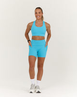 TRAINING RANGE POCKET BIKER SHORTS 4" - HYPER BLUE