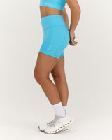 TRAINING RANGE POCKET BIKER SHORTS 4" - HYPER BLUE