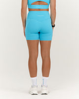 TRAINING RANGE POCKET BIKER SHORTS 4" - HYPER BLUE